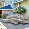 Salon de jardin d'angle gris clair installé sur une terrasse